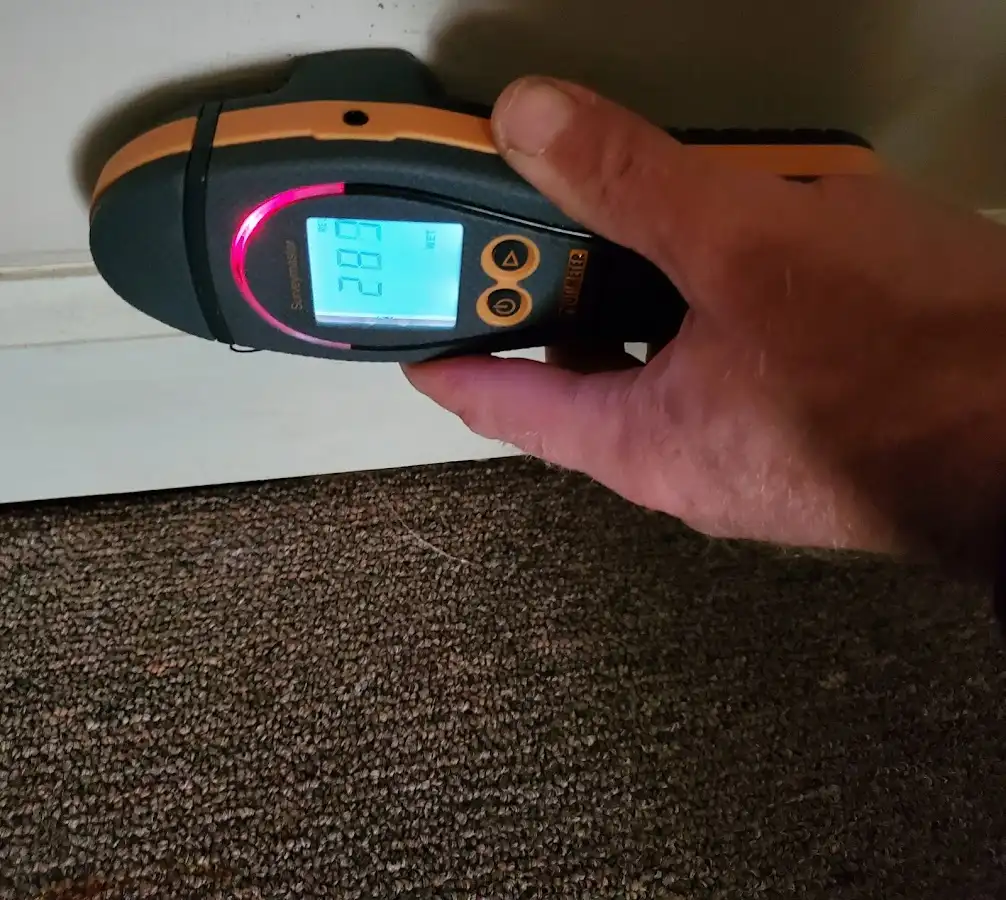 Moisture detection at baseboard during Storm Damage Restoration in Kent